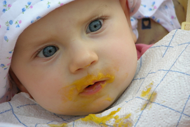 Baby with babyfood on face
