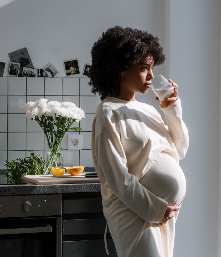 Pregnant woman holding drink