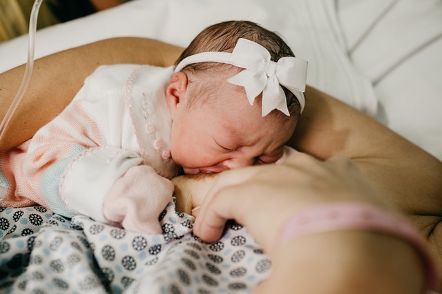 Breastfeeding Baby with bow headband