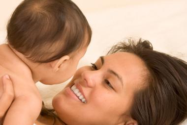 Mom smiling at baby