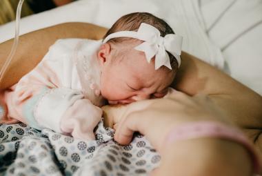 Breastfeeding Baby with bow headband