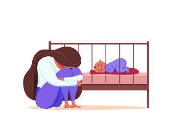 Sad woman sitting next to crib