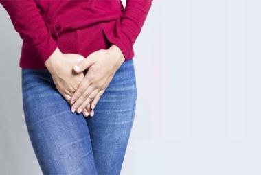 Woman holding bladder